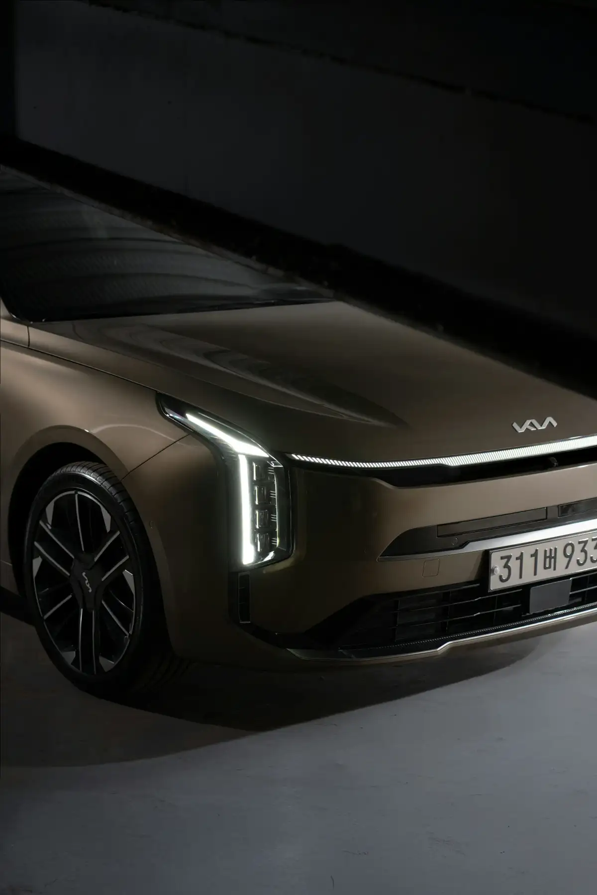 Here is a possible caption: a brown kia car is shown in this photo.
